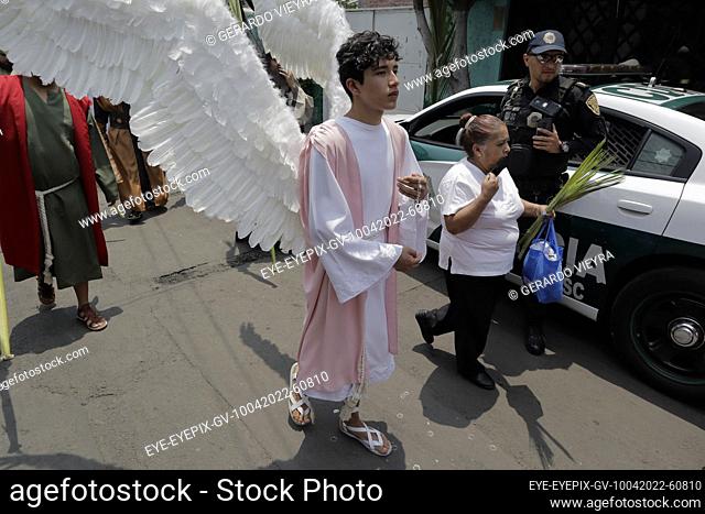 MEXICO CITY, MEXICO - APR 10, 2022: Residents of San Francisco Culhuacán, Coyoacán, take part during rendering of the Holy week procession to celebrate Palm...