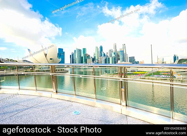 modern buildings near marina bay in singapore in cloud sky from empty bank