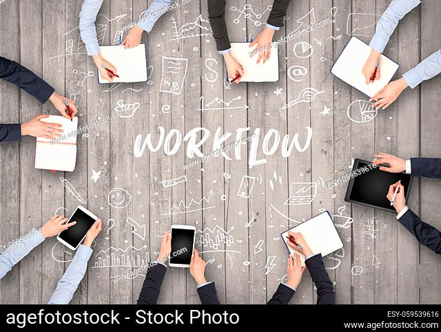 Group of business people working in office with WORKFLOW inscription, coworking concept