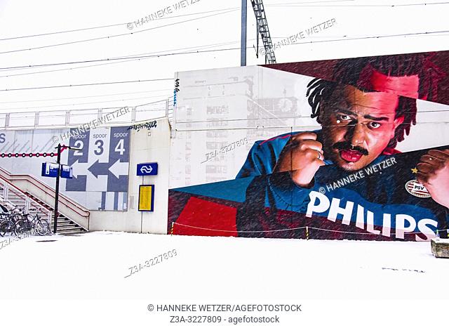 Train station Strijp-S with wall painting of rapper Fresku at industrial former Philips-complex Strijp-S, Eindhoven, The Netherlands, Europe