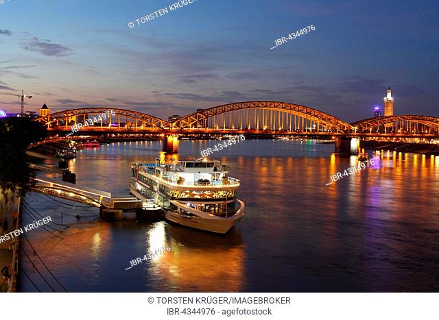Hohenzollern Bridge and pier on the Rhine at dusk, Cologne, North Rhine-Westphalia, Germany