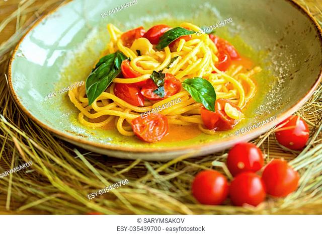Homemade pasta with Basil and tomatoes. Italian style