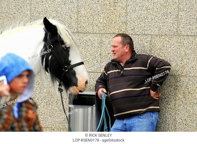 Republic of Ireland, Dublin, Smithfield Horse Market, A buyer with a horse at Smithfield Horse Market in Dublin
