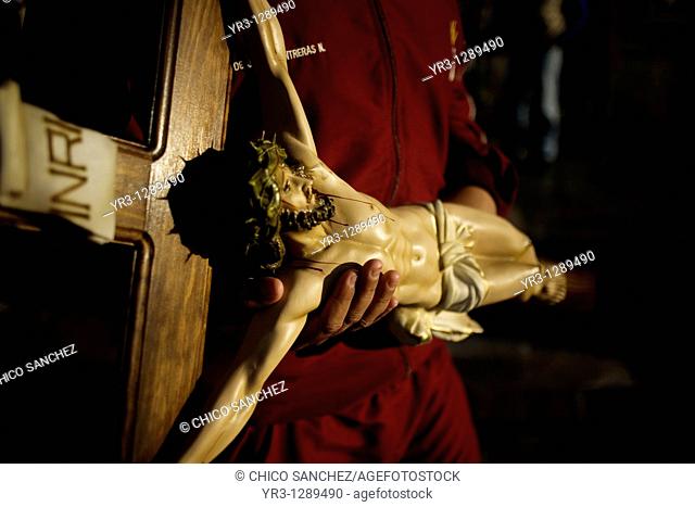A pilgrim hold a cross outside the Our Lady of Guadalupe Basilica in Mexico City, December 10, 2010  Hundreds of thousands of Mexican pilgrims converged on the...