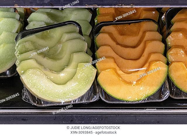 Sliced Canteloupe and Honeydew Melons, Wrapped in Plastic Containers and Offered for Sale in a NYC Supermarket