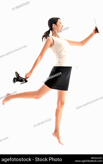 Excited jumping business young woman