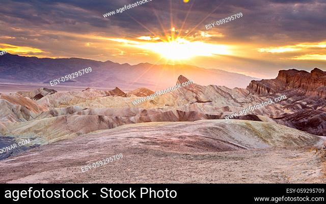 Sunset at Zabriskie point in Death Valley national park Eastern California in the northern Mojave Desert. One of the hotest places on earth