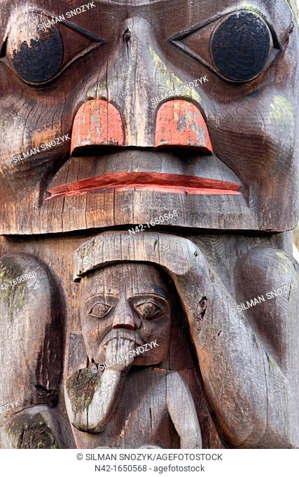 A mother cradles her child in a Haida Totem Pole, Thunderbird Park, Royal British Columbia Museum, Victoria, BC, Canada