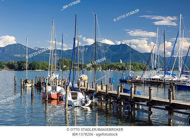 Sailboats in the port of Gstadt, view to Fraueninsel island, Chiemsee lake, Chiemgau, Upper Bavaria, Bavaria, Germany, Europe