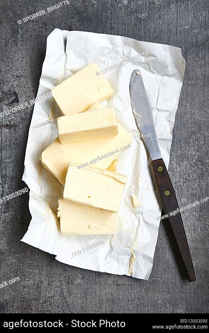 Butter on paper with a knife