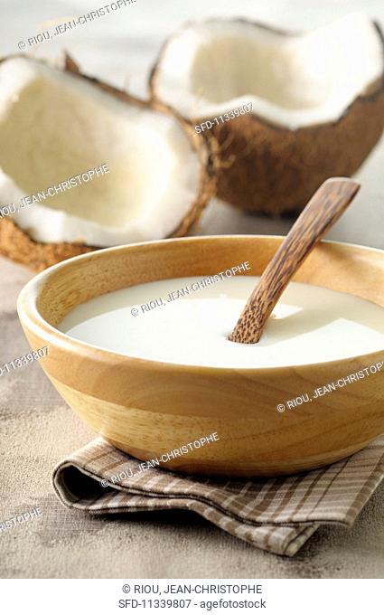 Coconut milk and an open coconut