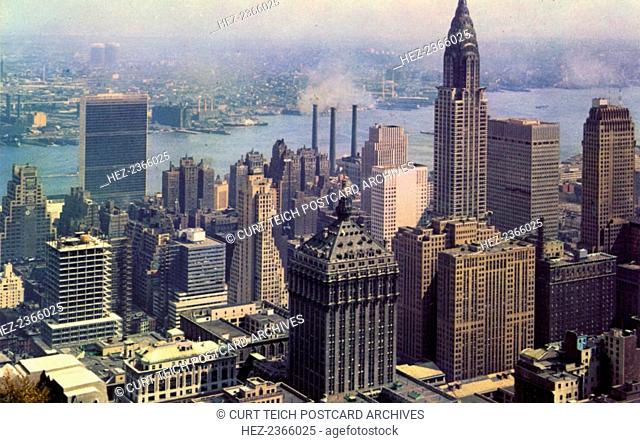 Looking southeast from the RCA Building, New York City, New York, USA, 1956. Vintage postcard showing bird's eye view of New York with the Chrysler