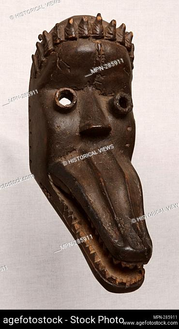 Author: Dan. Face Mask - Late 19th/early 20th century - Dan Liberia or Cte d'Ivoire Coastal West Africa. Wood, and metal, . 1875'1925