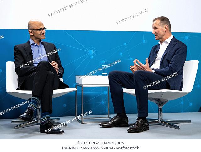 27 February 2019, Berlin: Herbert Diess (r), Chairman of the Board of Management of Volkswagen AG, and Satya Nadella, CEO of Microsoft