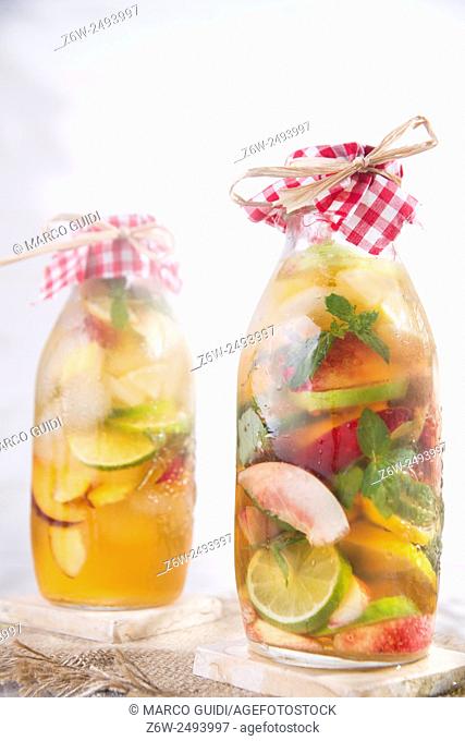 bottle of infused fruit tea with peach and lemon