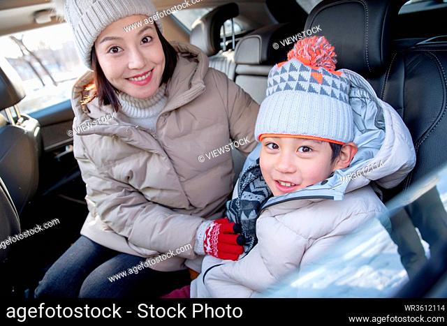 Young mothers and children sat in the car