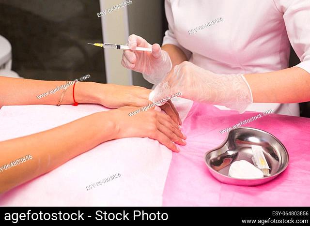 Beauty, cosmetology, cosmetic procedures and mesotherapy concept - Woman having botox treatment at beauty clinic