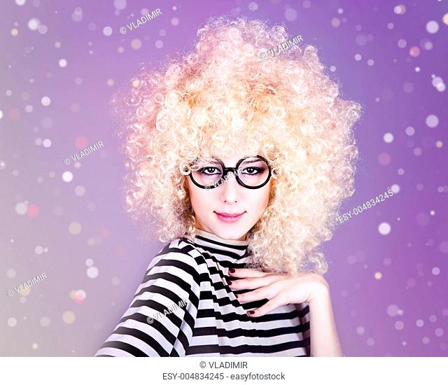 Portrait of funny girl in blonde wig