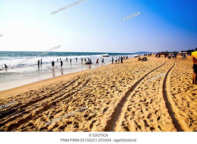 Tourists on the beach, Goa, India