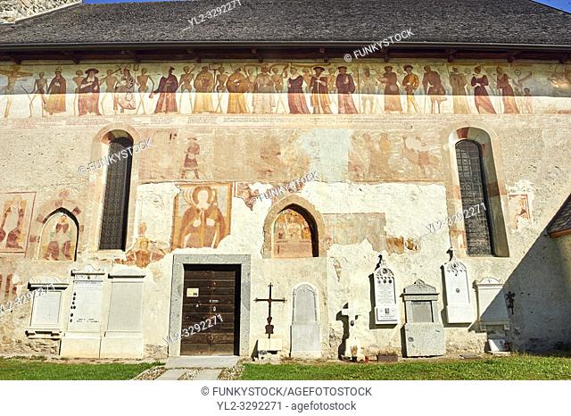Exterior of the Church of San Vigilio in Pinzolo and its fresco paintings â. œDance of Deathâ. . painted by Simone Baschenis of Averaria in1539, Pinzolo