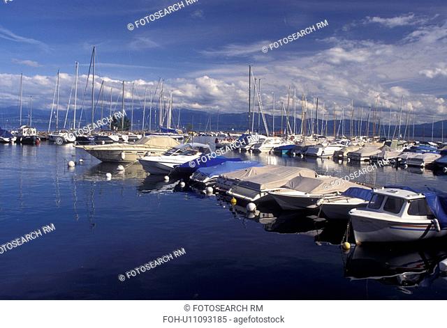 Switzerland, Vaud, Rolle, Lac Leman, La Cote, Boats docked at a marina in the harbor of Rolle on Lake Geneva in the Canton of Vaud