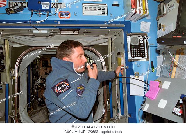 Soyuz Taxi Flight Engineer Roberto Vittori of the European Space Agency (ESA) uses a communication system in the Destiny laboratory on the International Space...