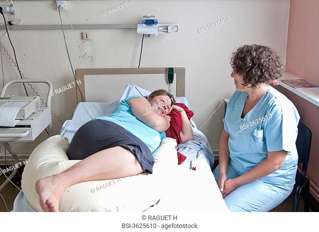 PREGNANT WOMAN AND MIDWIFE