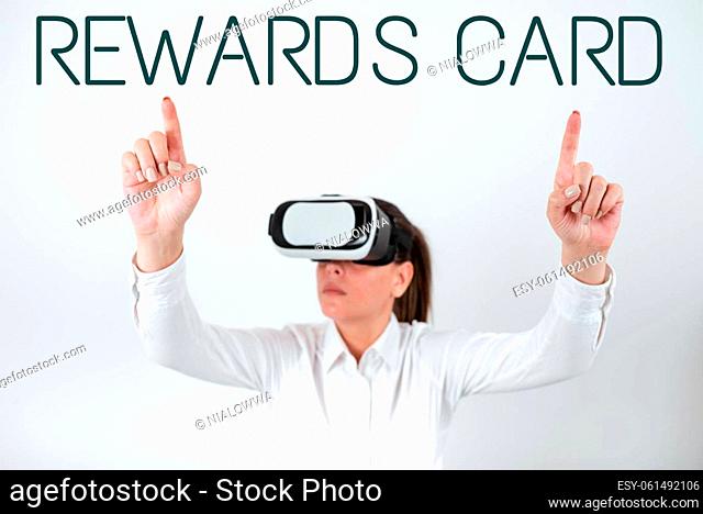 Conceptual caption Rewards Card, Word Written on Help earn cash points miles from everyday purchase Incentives Woman Wearing Vr Glasses And Pointing On...