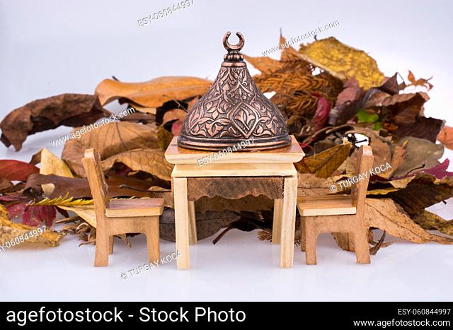 Table and stairs on a leaf background on display