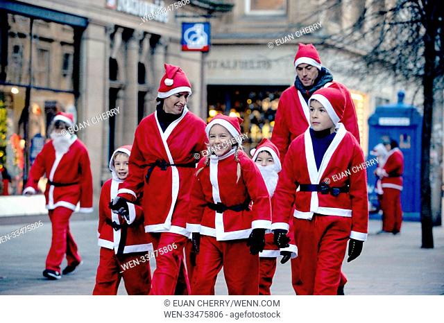 The annual Santa Dash in which 7, 500 people take to the streets in Glasgow in Santa suits for charity. Featuring: atmosphere Where: Glasgow