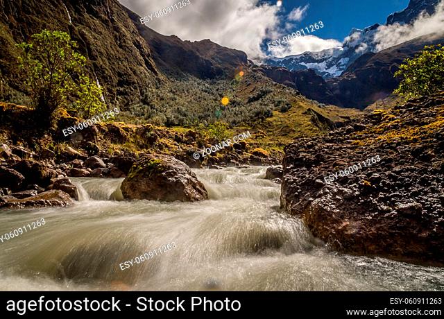 River in the Andes at El Altar Volcano in Ecuador. The Andean landscape near Banos in Ecuador is superb, from volcanic glaciers rivers flow through the...