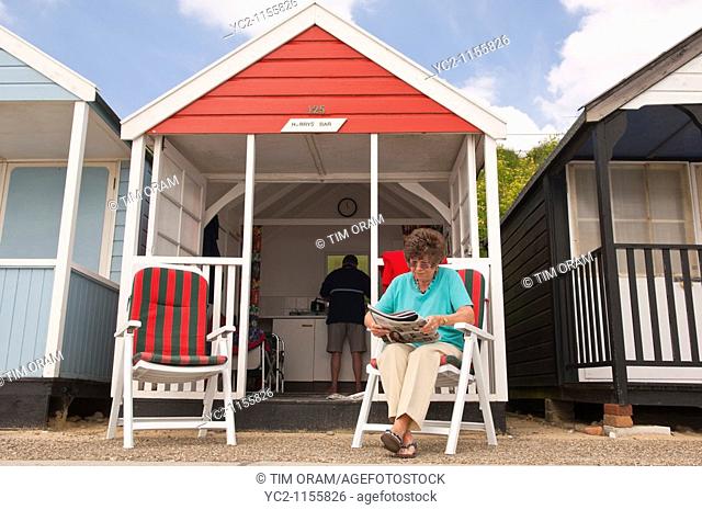 A couple at their beach hut at Southwold , Suffolk , England , Great Britain , Uk