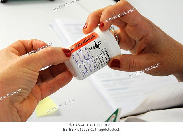 Reportage in a pharmacy in Auxi-le-Château, France. A pharmacy technician prepares a glycerol starch-based treatment