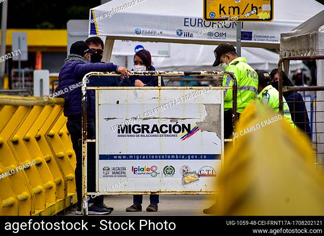 A fence of Colombia's migration offices closes the walking path between Ecuador and Colombia as drivers of public service vehicles hold protest on the Rumichaca...