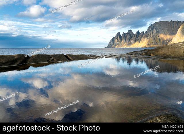 Norway, Senja, Skaland, Tungeneset, mirroring sky and clouds