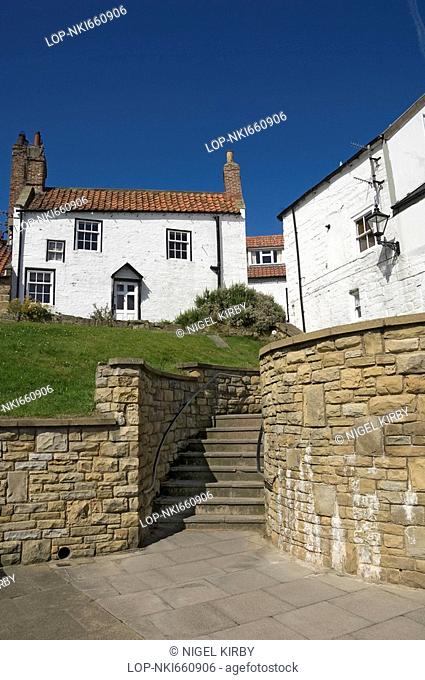 England, North Yorkshire, Robin Hoods Bay, Cottages on the seafront. Robin Hoods Bay is the end of the Wainwright Coast to Coast Walk across the North of...