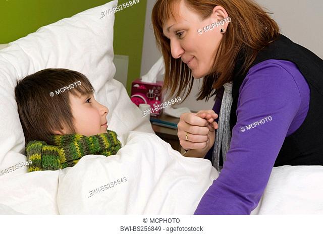 mother with her sick at the bed