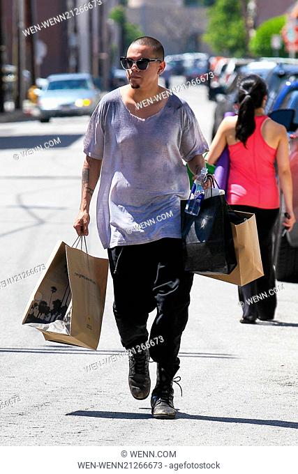 Evan Ross shopping on Ventura Boulevard in Studio City with a large bag from California Pizza Kitchen Featuring: Evan Ross Where: Los Angeles, California