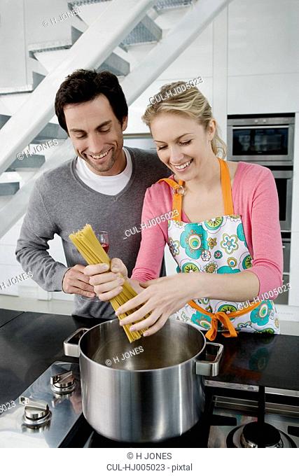 Portrait of a couple cooking