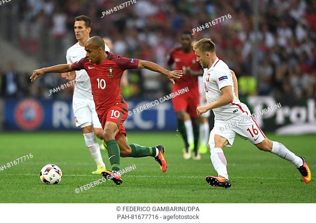 Jakub Blaszczykowski (L) of Poland and Joao Mario of Portugal vie for the ball during the UEFA EURO 2016 quarter final soccer match between Poland and Portugal...