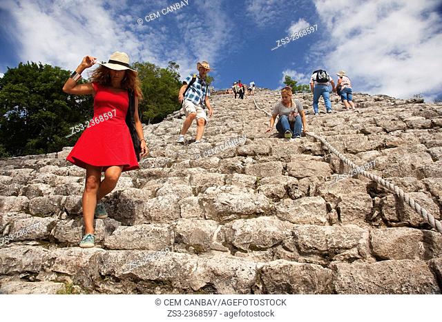 Tourists climbing up and down to the Nohoch Mul Pyramid at the Prehispanic Mayan city of Coba Archaeological Site, Quintana Roo, Yucatan Province, Mexico