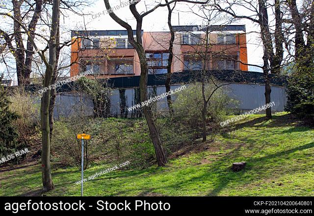 One of buildings behind a massive concrete wall separating properties of the Embassy of the Russian Federation from Stromovka park in Prague, Czech Republic
