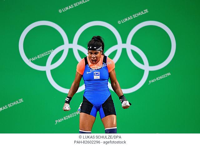 Mathlynn Sasser of the Marshall Islands reacts during the Women's 58kg Group B category of the Rio 2016 Olympic Games Weightlifting events at the Riocentro in...