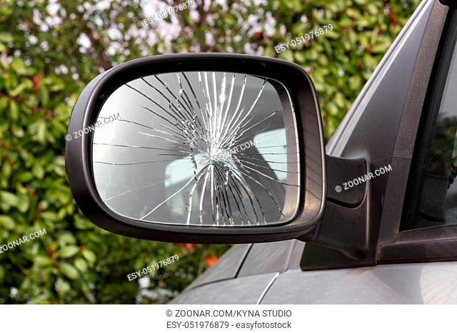 Closeup of damaged rearview mirror