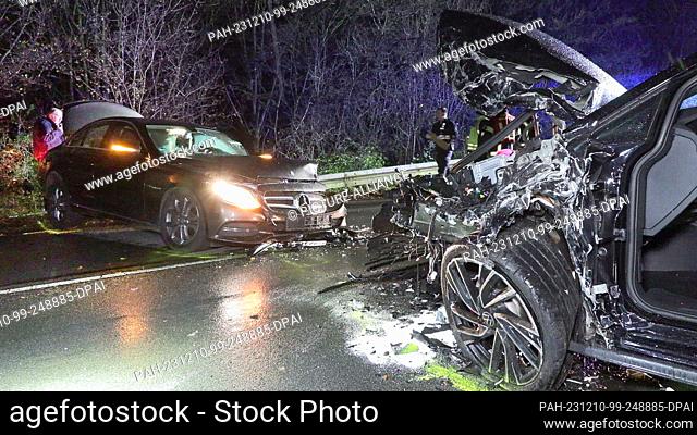 10 December 2023, North Rhine-Westphalia, Bergheim: Two cars on the road after an accident. Both drivers were seriously injured in a head-on collision between...