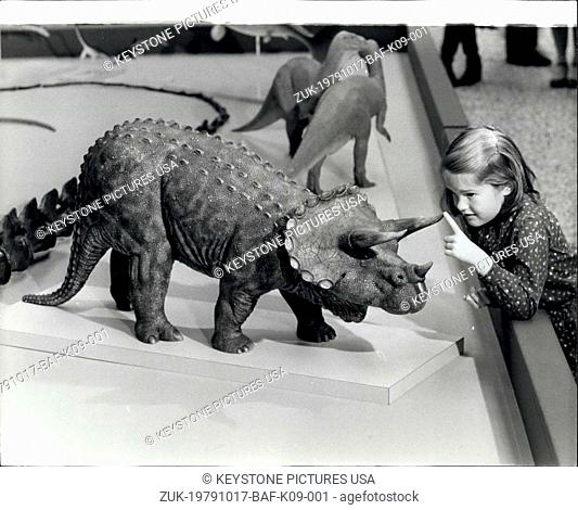 Oct. 17, 1979 - 'Dinosaurs and Their living relatives' Exhibition Laura Polk, aged 8, examining a model of a horned triceratops