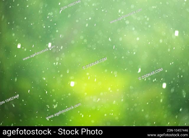 Green spring background bokeh blurred glare rain