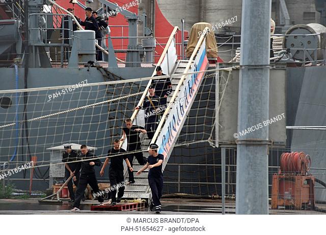 Sailors disembark from a Russian warship in a shipyard in Saint Nazaire,  France, 8 August 2014. The French government announced that it would not deliver the...