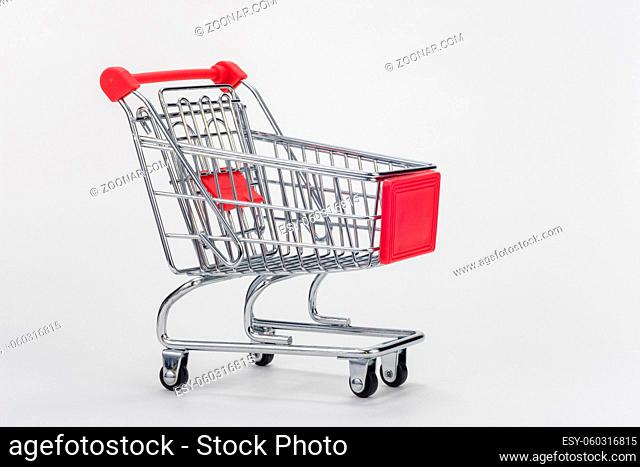 Empty grocery cart on white background