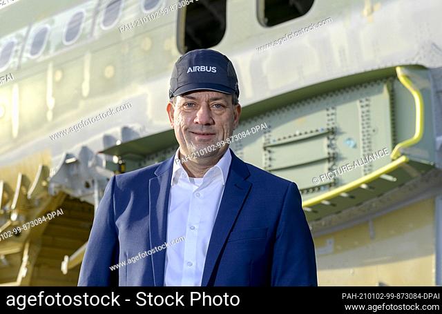 21 December 2020, Hamburg: André Walter, Hamburg's Airbus boss, stands in front of a fuselage of an A320 family aircraft on the factory site